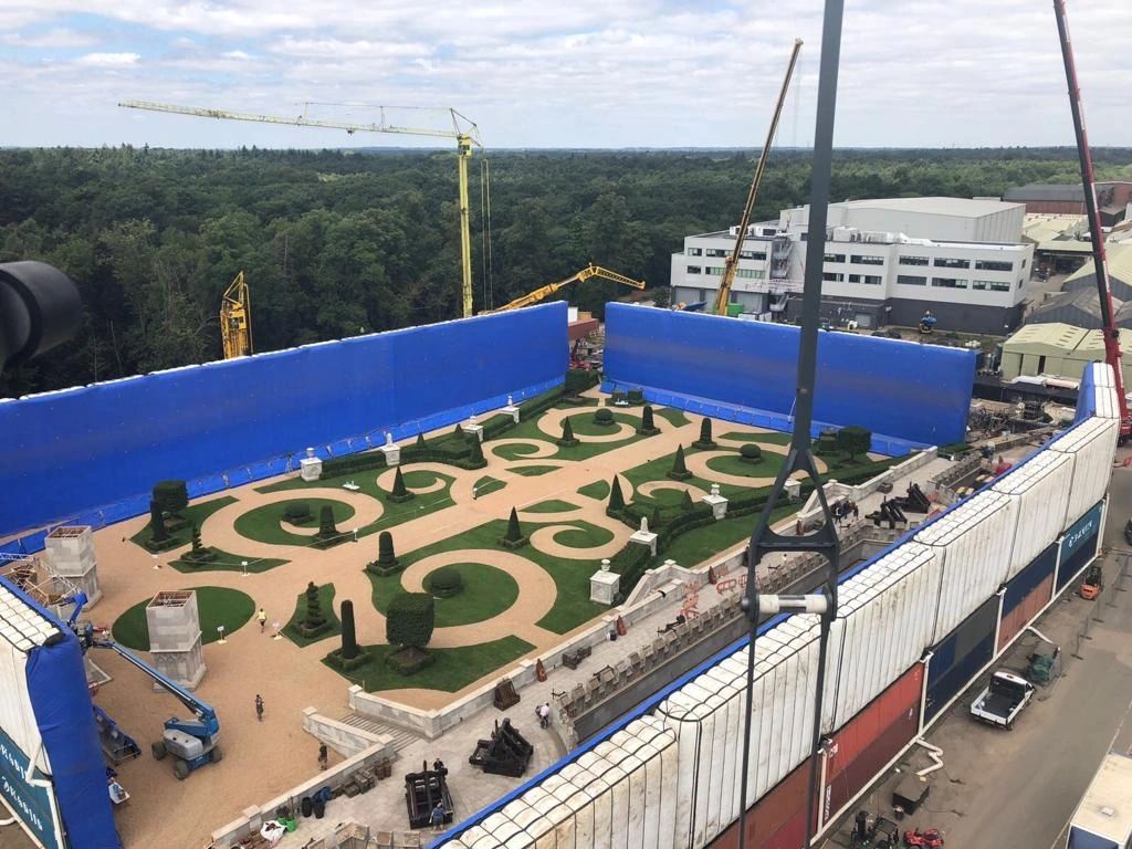 Aerial view of a blue AirWall surrounding a formal garden set
